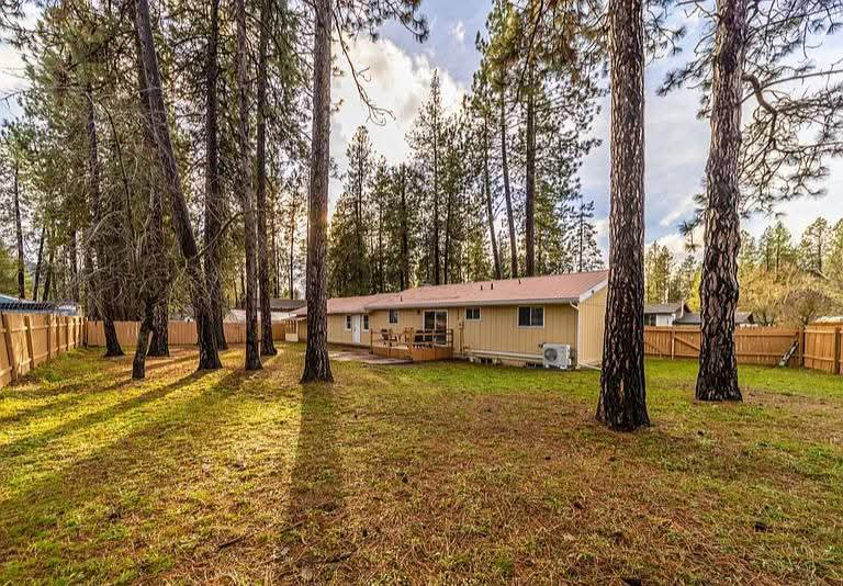 Exterior-beige-home-with-large-trees Exterior-beige-home-with-large-trees